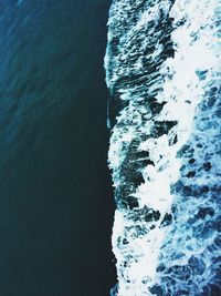 Scenic view of sea against rock formation