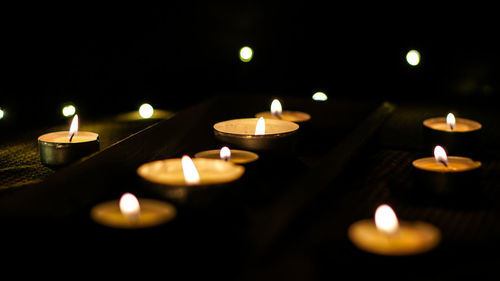 Close-up of illuminated tea light candles