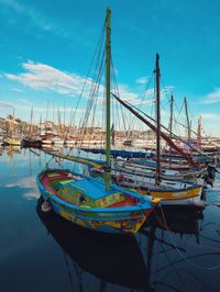 Boats moored at harbor