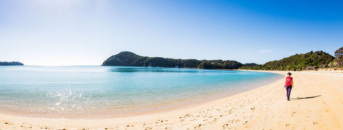 Scenic view of beach against clear sky