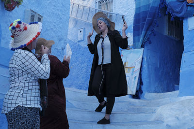 People standing in snow during winter