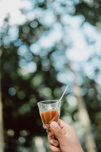 Close-up of hand holding drink