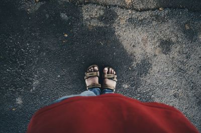 Low section of woman standing on tiled floor