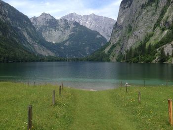 Scenic view of lake and mountains against sky