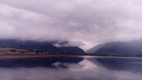 Scenic view of lake with mountains in background