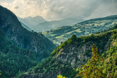 Sunset over the mountains in trentino alto adige with vineyards and orchards