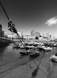 Boats moored at harbor