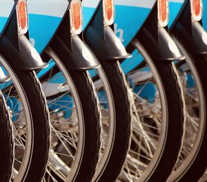 Close-up of bicycle parked in row