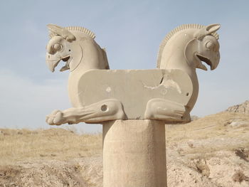 Low angle view of statue against sky