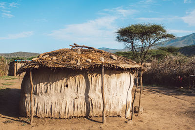 House on field against sky