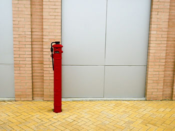 Red fire hydrant on wall