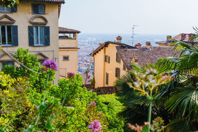 Scenic view of sea and buildings against sky