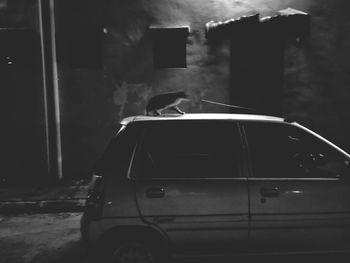 Car on street against building at night