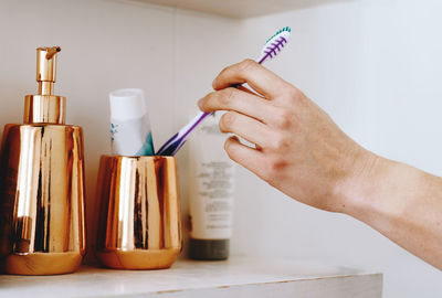 Cropped hand of person cleaning equipment