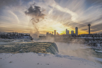 Scenic view of sea against sky during winter