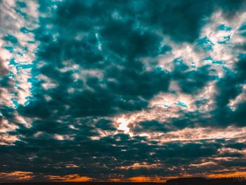 Low angle view of dramatic sky during sunset