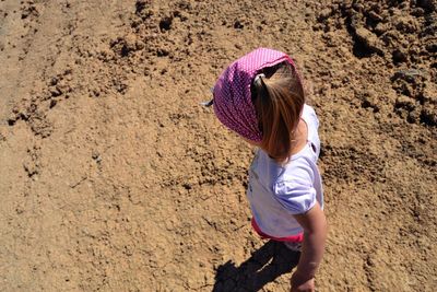 High angle view of girl walking on ground