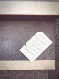 High angle view of open book on road