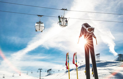 Low angle view of ski lift against sky