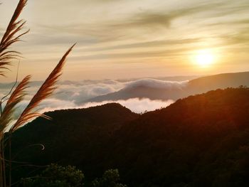 Scenic view of silhouette mountains against sky at sunset