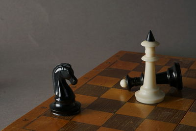 Close-up of chess pieces on table