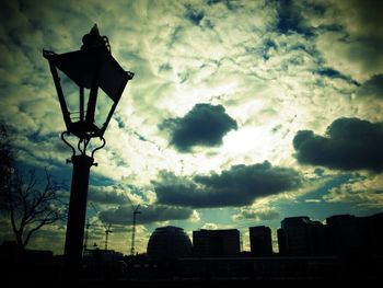 Low angle view of building against cloudy sky