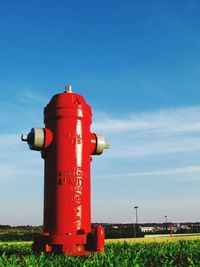 Red lighthouse against clear blue sky