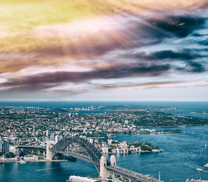 High angle view of buildings against cloudy sky