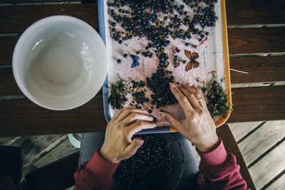 Close-up of person with berries