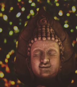 Close-up portrait of smiling buddha statue