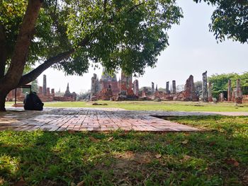 View of temple on field against sky