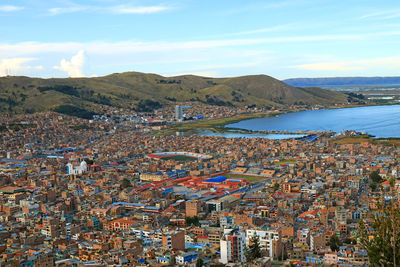 View of lake titicaca and city of puno from the condor hill view point, puno, peru