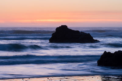 Scenic view of sea at sunset