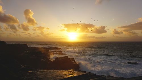 Scenic view of sea against sky during sunset