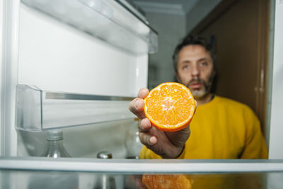 Portrait of man holding ice cream