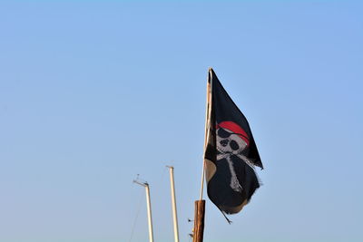 Low angle view of flag against sky