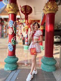 Low section of woman standing in market