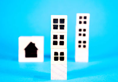 Close-up of objects on table against blue background