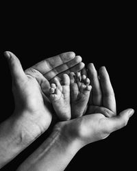 Baby's feet in mothers hands