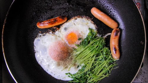 High angle view of meat in cooking pan