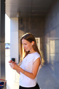 Young woman using mobile phone