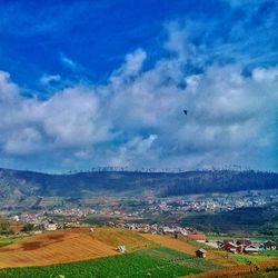 Scenic view of landscape against cloudy sky