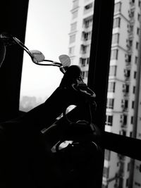 Low angle view of man sitting in building