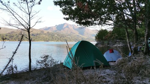 Scenic view of lake with mountains in background