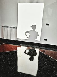 Reflection of man on stage