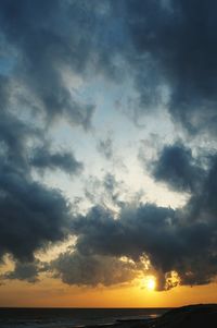Scenic view of sea against dramatic sky