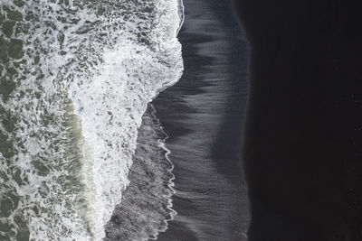 Close-up of sea against black background