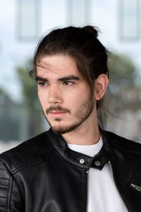 Portrait of young man looking away