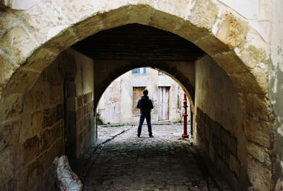 People walking in front of building