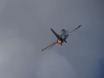 Low angle view of airplane flying in sky